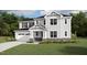 Beautiful new construction home with stone accents, attached garage, and covered entryway at 1805 Harrell Cove Ct # 180 Eldorado Fc, Fuquay Varina, NC 27526