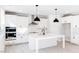 Modern kitchen featuring white cabinets, stainless steel appliances, and a center island at 1805 Harrell Cove Ct # 180 Eldorado Fc, Fuquay Varina, NC 27526