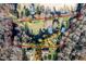 Aerial view of property showing the boundaries, mature trees, and structures on the acreage at 1835 Pearidge Rd, Angier, NC 27501
