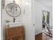 Stylish bathroom with shiplap walls, vessel sink, and a round mirror adds rustic charm at 1835 Pearidge Rd, Angier, NC 27501