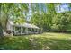 Charming home featuring a spacious porch and a beautiful yard with mature trees at 1835 Pearidge Rd, Angier, NC 27501
