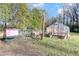 Backyard greenhouse with a chicken coop is ideal for gardening enthusiasts at 1835 Pearidge Rd, Angier, NC 27501