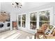 Laundry room featuring washer and dryer, natural light, modern light fixture, and vintage furniture at 1835 Pearidge Rd, Angier, NC 27501