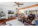 Inviting living room with a wood-burning stove, comfortable seating, and open to the dining area at 1835 Pearidge Rd, Angier, NC 27501