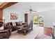 Cozy living room with a leather sofa, wood-burning stove, and sliding glass doors at 1835 Pearidge Rd, Angier, NC 27501
