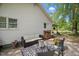 Back patio featuring an outdoor seating area with a fire pit, perfect for entertaining guests at 1835 Pearidge Rd, Angier, NC 27501