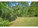 Picturesque pond surrounded by lush greenery, offering a tranquil escape at 1835 Pearidge Rd, Angier, NC 27501