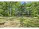 Expansive lawn area, partly fenced, with mature trees providing shade at 1835 Pearidge Rd, Angier, NC 27501