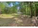 Spacious yard surrounded by mature trees, offering privacy and tranquility at 1835 Pearidge Rd, Angier, NC 27501