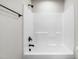 Modern bathroom featuring white subway tile, black fixtures, and a shower head at 186 Gumtop Dr, Zebulon, NC 27597