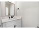 Modern half-bathroom with a stylish mirror, vanity, and attractive fixtures at 186 Gumtop Dr, Zebulon, NC 27597