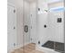 Modern bathroom featuring a glass-enclosed shower with subway tile and a stylish shower head at 186 Gumtop Dr, Zebulon, NC 27597
