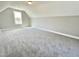 This bedroom features plush gray carpet and ample natural light from the single window at 186 Gumtop Dr, Zebulon, NC 27597