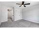 Spacious bedroom with gray carpet with access to a walk-in closet at 186 Gumtop Dr, Zebulon, NC 27597