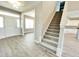 Inviting foyer with wood-look floors and a staircase leading to the upper level at 186 Gumtop Dr, Zebulon, NC 27597