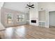 Bright living room with vaulted ceiling, fireplace with built-ins, and a view to the outdoors at 186 Gumtop Dr, Zebulon, NC 27597