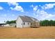 New home with covered rear porch in partially landscaped backyard at 186 Gumtop Dr, Zebulon, NC 27597