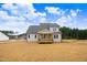 New home with a covered porch and an expansive backyard at 186 Gumtop Dr, Zebulon, NC 27597
