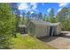 Exterior view of the home featuring a screened-in porch, patio, sliding doors, and a surfboard at 205 Sacred Fire Rd, Louisburg, NC 27549