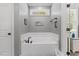 Clean bathroom featuring a soaking tub with black faucet at 205 Sacred Fire Rd, Louisburg, NC 27549