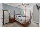 Cozy bedroom featuring a four-poster bed, soft lighting, and a stylish color palette at 205 Sacred Fire Rd, Louisburg, NC 27549