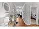 Spacious foyer with hardwood floors and elegant decor that leads to living areas and bedrooms at 205 Sacred Fire Rd, Louisburg, NC 27549