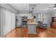 Modern kitchen featuring stainless steel appliances, granite countertops, and an island with seating at 205 Sacred Fire Rd, Louisburg, NC 27549