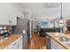 Modern kitchen, with stainless appliances, flows to living area with tv at 205 Sacred Fire Rd, Louisburg, NC 27549