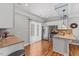 Bright kitchen with stainless steel appliances, granite countertops, and hardwood flooring at 205 Sacred Fire Rd, Louisburg, NC 27549