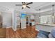 Open concept kitchen with granite countertops, stainless steel appliances, and hardwood floors at 205 Sacred Fire Rd, Louisburg, NC 27549