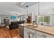 Open-concept kitchen and living area featuring granite countertops and a seamless flow at 205 Sacred Fire Rd, Louisburg, NC 27549