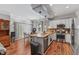 Spacious kitchen with stainless steel appliances, granite countertops, and access to dining area at 205 Sacred Fire Rd, Louisburg, NC 27549