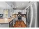Modern kitchen featuring stainless steel appliances, granite countertops, and ample cabinet space at 205 Sacred Fire Rd, Louisburg, NC 27549