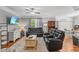 Comfortable living room featuring leather sofas, ceiling fan, and tv at 205 Sacred Fire Rd, Louisburg, NC 27549