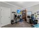 Functional office space with built-in shelving, a large desk, and a comfortable workspace at 205 Sacred Fire Rd, Louisburg, NC 27549
