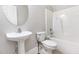 Clean bathroom with a pedestal sink, white tile, and convenient shower and tub combination at 2106 Cloud Cover Ln, Raleigh, NC 27614