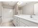 Well-lit bathroom with double sinks and a tub shower at 2106 Cloud Cover Ln, Raleigh, NC 27614