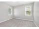 Bright bedroom featuring two large windows allowing for natural light at 2106 Cloud Cover Ln, Raleigh, NC 27614