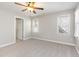 Cozy bedroom offering ample natural light and a ceiling fan at 2106 Cloud Cover Ln, Raleigh, NC 27614