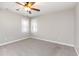 Neutral bedroom with carpet and large windows providing ample natural light at 2106 Cloud Cover Ln, Raleigh, NC 27614