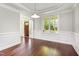 Charming dining room with large windows, crown molding, and hardwood flooring at 2106 Cloud Cover Ln, Raleigh, NC 27614