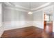 Elegant dining room showcasing crown molding and hardwood floors, perfect for entertaining at 2106 Cloud Cover Ln, Raleigh, NC 27614