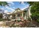 Charming home boasts a spacious front porch, complemented by lush landscaping and serene surroundings at 2106 Cloud Cover Ln, Raleigh, NC 27614