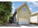 Two-story home featuring an attached garage, screened porch, light green siding and concrete driveway at 2106 Cloud Cover Ln, Raleigh, NC 27614
