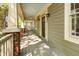Spacious front porch featuring brick accents, providing a welcoming entrance to the home at 2106 Cloud Cover Ln, Raleigh, NC 27614