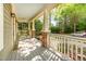 Inviting front porch with brick pillars and a light-colored railing, perfect for relaxing outdoors at 2106 Cloud Cover Ln, Raleigh, NC 27614