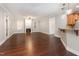 Spacious living room with hardwood floors, fireplace, and ample natural light creating a cozy atmosphere at 2106 Cloud Cover Ln, Raleigh, NC 27614