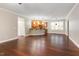 Open-concept living room seamlessly connecting to the kitchen, featuring hardwood floors and ample natural light at 2106 Cloud Cover Ln, Raleigh, NC 27614