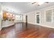 Spacious living room featuring hardwood floors, modern lighting, and access to the outdoors at 2106 Cloud Cover Ln, Raleigh, NC 27614
