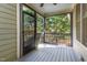 Screened in porch with a ceiling fan and views of the backyard at 2106 Cloud Cover Ln, Raleigh, NC 27614
